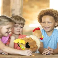 HearthSong Plush Musical Egg-Laying Hen with Three Eggs