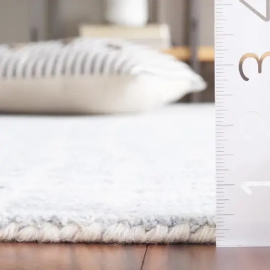 Ebony EBN920 Handmade Tufted Rug - Safavieh image {2}