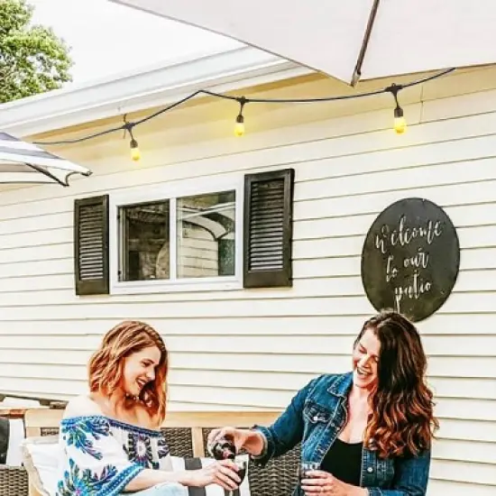 Brightech 12-Bulb LED Ambience Pro Solar 1W 27ft 2200K S14 Outdoor Hanging String Lights Flaming Bulb Black Wire image {1}