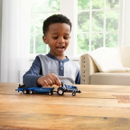 1/64 New Holland "Blue Blazes" Pulling Tractor with Pulling Sled, 37940-1 image {5}