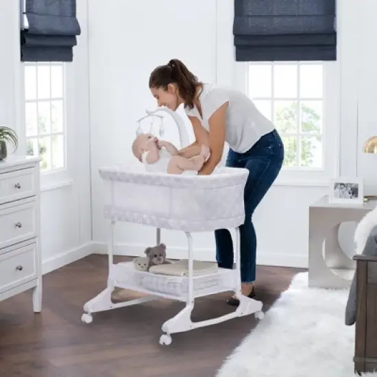 Delta Children SleepCool Rocking Bassinet with Airflow Mesh image {1}
