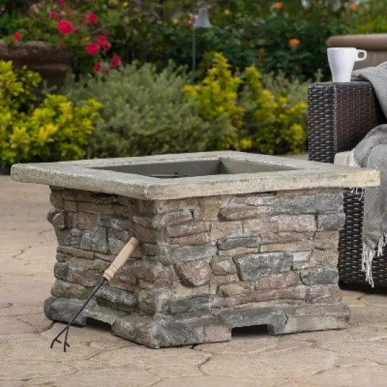 28-Inch Outdoor Wood-Burning Fire Pit with Stone-Inspired Base and Protective Lid image {1}