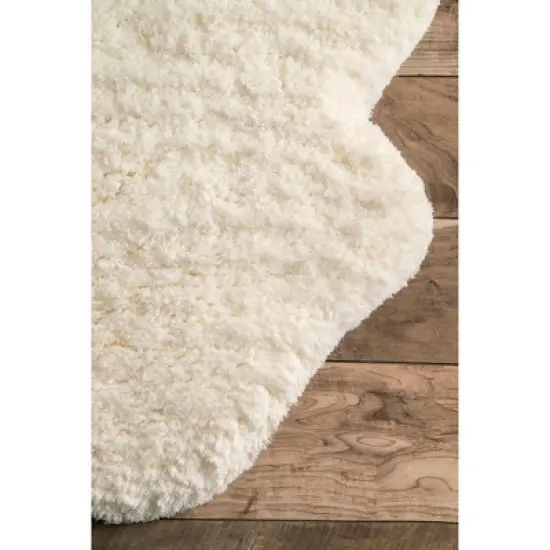 nuLOOM Hand Tufted Sexto Pelt Faux Sheepskin Area Rug, Shaped 4' 9" x 6', Natural image {2}