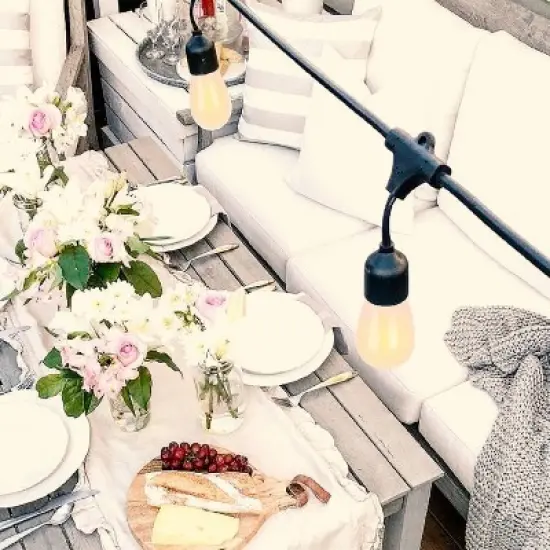 Brightech 12-Bulb LED Ambience Pro Solar 1W 27ft 2200K S14 Outdoor Hanging String Lights Flaming Bulb Black Wire image {2}