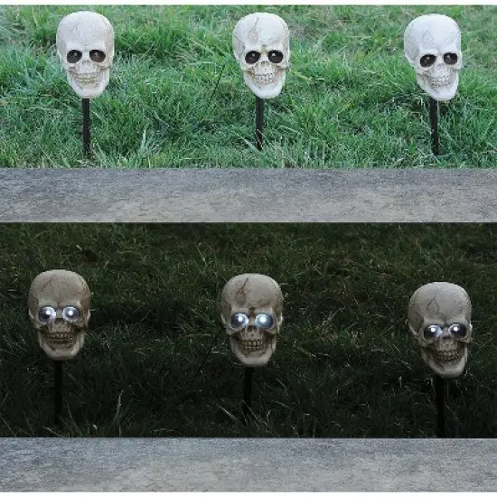 Magic Power Lighted Skull Pathway Markers - 6.5 in x 4 in - White image {1}