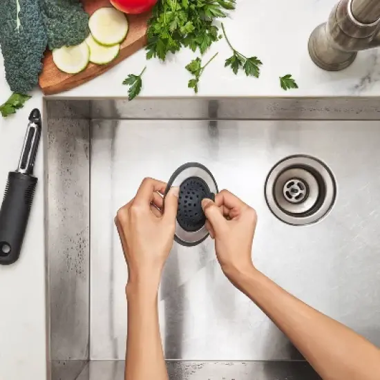 OXO Silicone Sink Strainer with Stopper: Black, Stainless Steel, Kitchen Drain Plug, Dishwasher-Safe, 4.3" Diameter image {4}