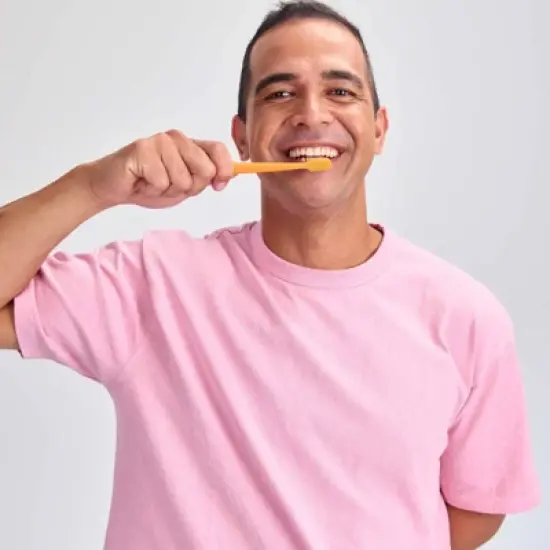 Grin Charcoal-Infused 100% Recycled Toothbrush for Sensitive Teeth and Gums - Orange - Medium image {2}