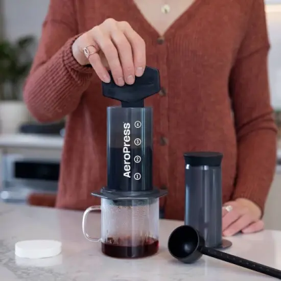 AeroPress Original Coffee Press: Manual Single Serve Coffee Maker, 8 oz Capacity, Includes Scoop & Paper Filters, Black image {3}