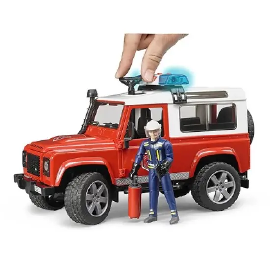 Bruder Land Rover Fire Department vehicle with fireman image {2}