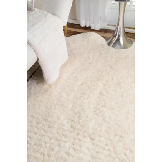 nuLOOM Hand Tufted Sexto Pelt Faux Sheepskin Area Rug, Shaped 4' 9" x 6', Natural image {3}