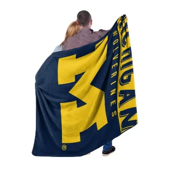 60" x 80" NCAA Michigan Wolverines Raschel Throw Blanket image {3}
